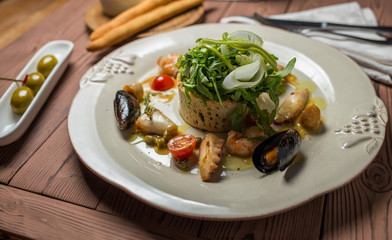 Various Seafood Salad on wooden table