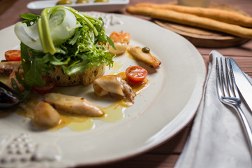 Various Seafood Salad on wooden table