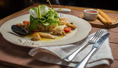 Various Seafood Salad on wooden table