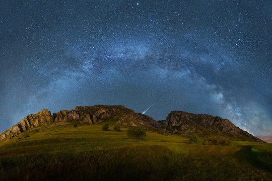 Milky way over Piatra Secuiului in Romania panorama