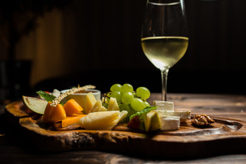 fruit dish with white wine served on desk