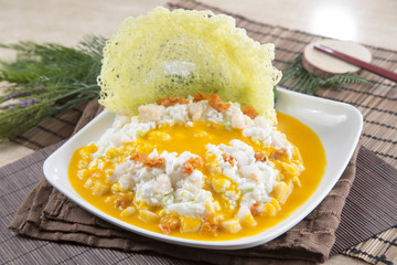 Traditional chinese plate of egg soup on the table in restaurant