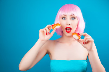 Beautiful girl with red lips and pink hair