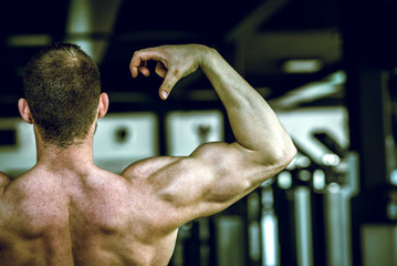 Man showing back in gym