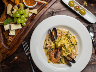 pasta seafood in tomato sauce with shrimp and tomatoes
