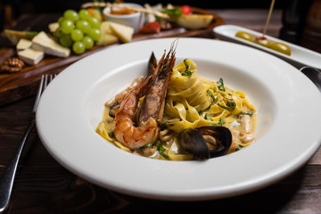 pasta seafood in tomato sauce with shrimp and tomatoes