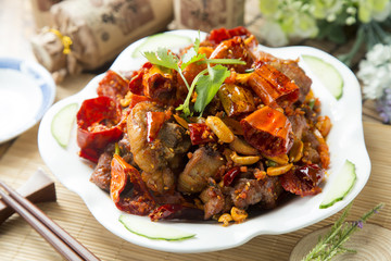 Spicy chinese braised pork on white plate