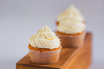 Vanilla cupcake with swiss merignue buttercream - obrazy, fototapety, plakaty