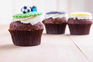 Delicious cupcakes on table