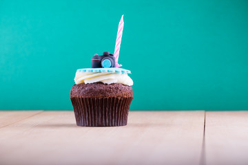 Delicious cupcake on table