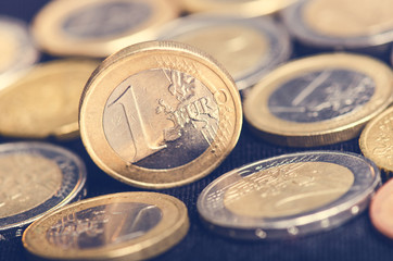 Euro money. Coins are isolated on a dark background. Currency of Europe. Balance of money. Coins values of one and two euro.