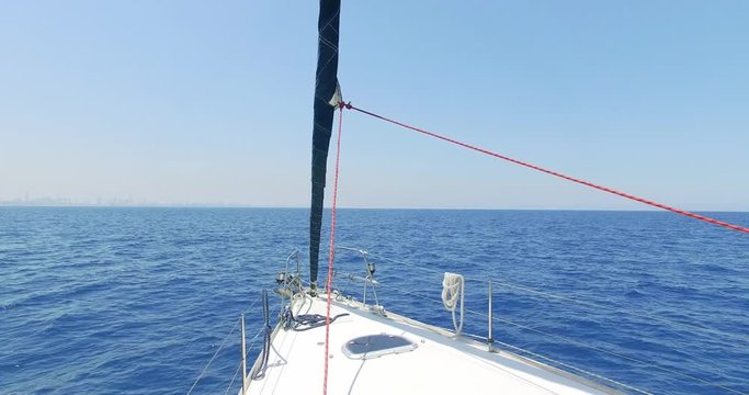 Sailing in the wind through the waves (4K) Sailing boat shot in 4K at the Mediterranean sea.Israel.
