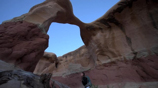 Young Woman Hiker in Devil's Garden Grand Staircase Escalante National Monument slow Trucking