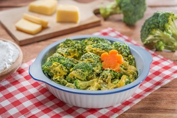Bowl of salad with cauliflower and cheese on the table in restaurant
