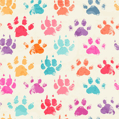 Abstract seamless pattern with bright colorful hand paw prints © lumitar