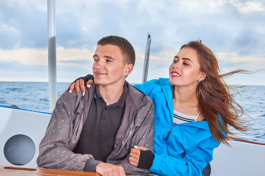 Happy couple woman and man traveling on vacation travel sailing