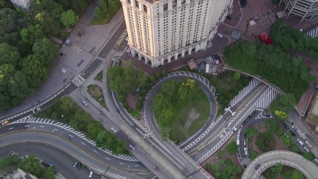 Flying above a highway interchange and over City Hall in New York City