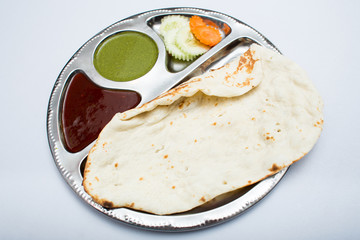 Indian tray meal with bread and sauce