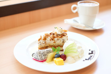 Dessert of tropical fruit and cake