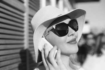 European woman searching information on cell telephone while sit