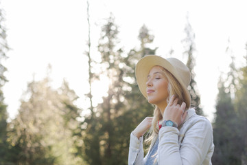 Lifestyle summer image of pretty blonde hipster woman with bag p