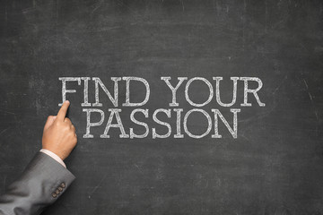 Find Your Passion text on blackboard with businessman hand pointing