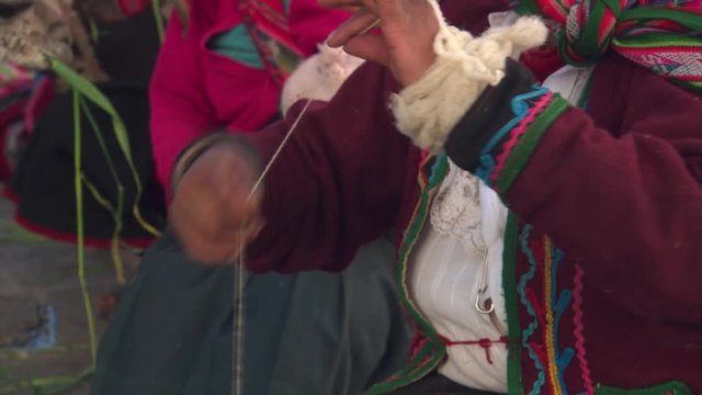 Peruvian woman spinning wool