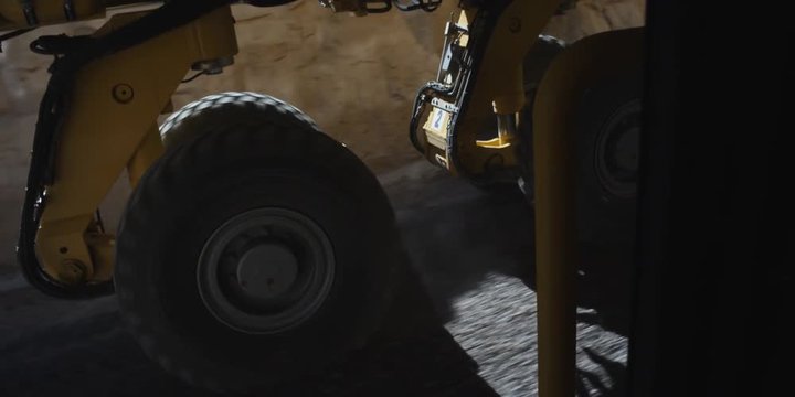 Axle-mount view of rolling dual wheels on a piece of heavy equipment