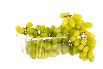 green grapes in a  plastic box