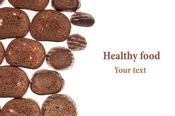 Decorative edging pieces of black rye bread on a white background. Isolated. Border. Pattern. Food background. View from above.