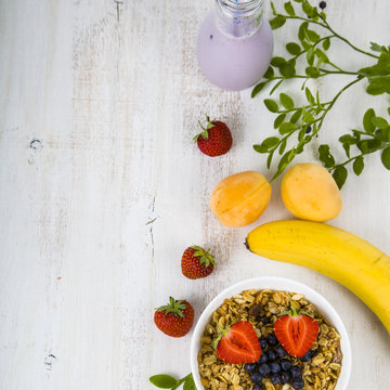 Granola with fruits on a wooden table