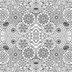 Full frame beautiful symmetrical seamless background filled with circular  flower like shapes in black and white