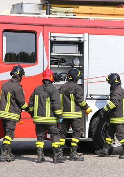 firefighters with fire engine truck