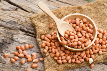 Peanuts on wooden bowl at rustic organic farm