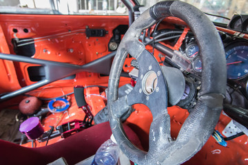 steering wheel , old interior of ruined truck