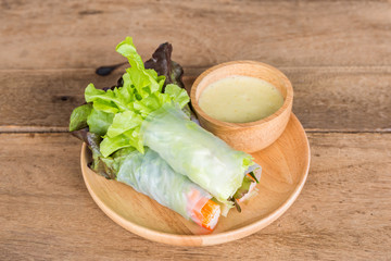 Vegetable salad in wooden plate.