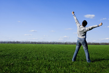 man and green field