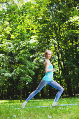 Fototapeta premium Woman doing exercise with dumbbells in the park.