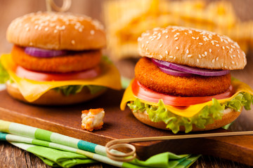Delicious fish burgerserved with fresh french fries.
