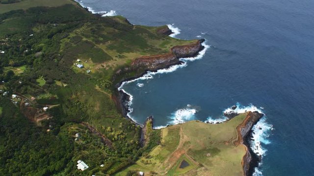 Orbiting shoreline of Maui with zoom-out to wide view of landscape. Shot in 2010.