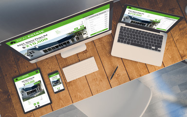 top view workplace with devices showing real estate online respo