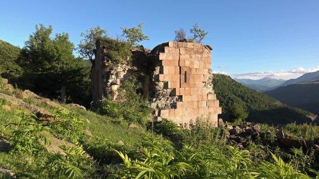 Ruins of the medial armenian Karsnits Mankants church. Dolly shot