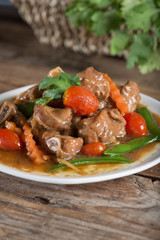 Baked pork ribs with soy sauce and vegetable.