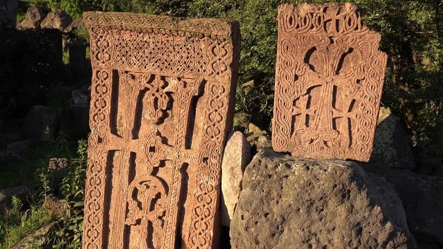Dolly shot of the medieval armenian croos stones at evening