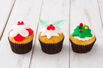 Christmas cupcake on a white wooden table 

