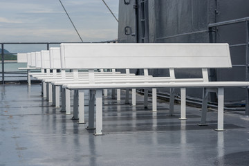 White benches on the deck ferry.