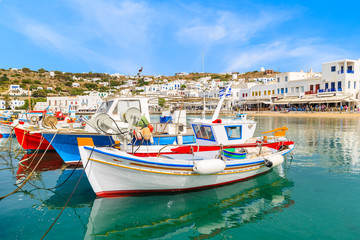 Typical colourful Greek fishing boat in Mykonos town port on island of Mykonos, Cyclades, Greece