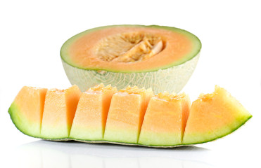 Melon cut pieces on white background.