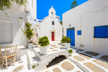 Square with church on whitewashed street with typical Greek architecture in beautiful Mykonos town, Cyclades islands, Greece © pkazmierczak