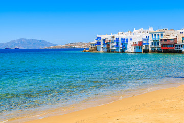 A view of beach and colorful houses in Little Venice part of Mykonos town, Mykonos island, Greece